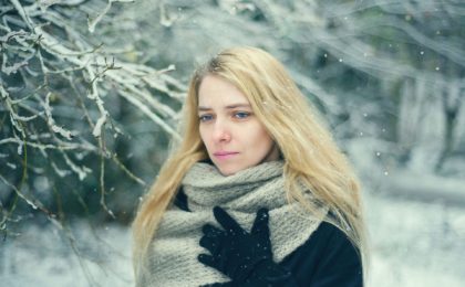 stressed woman with scarf in snow