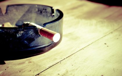 burning cigarette in ashtray